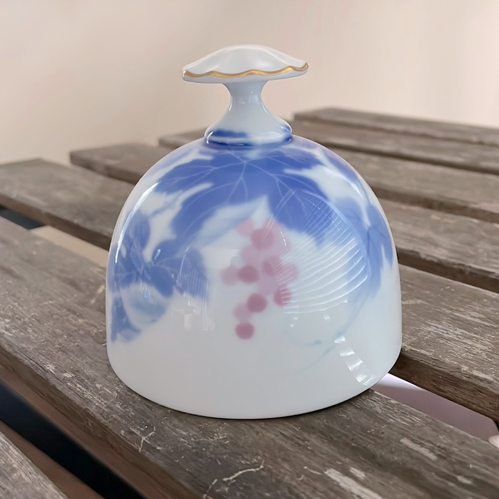 Danbury Mint Porcelain bell. Japan. Soft blue and mauve floral on white.